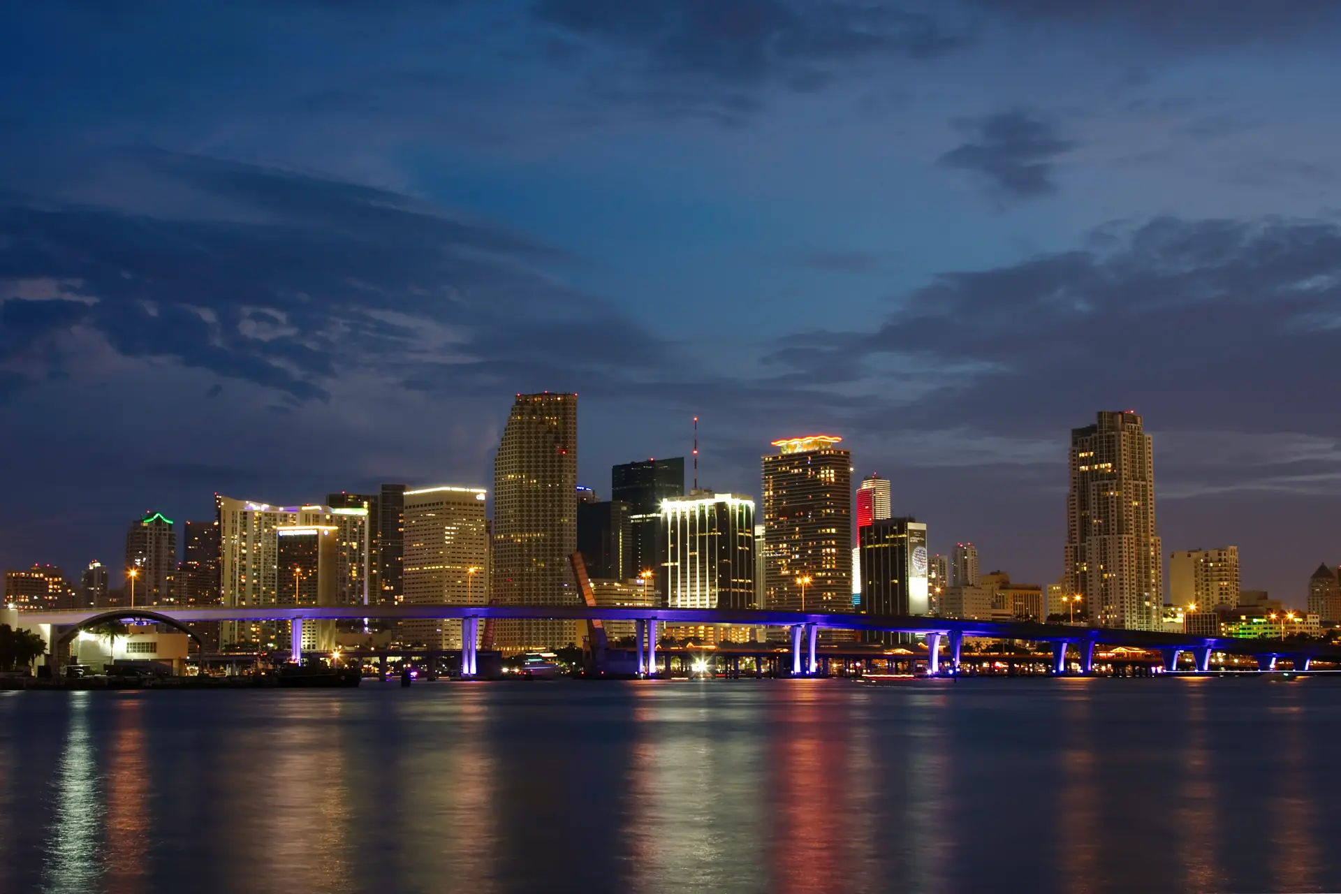 Downtown Miami skyline at dusk across Biscayne Bay
